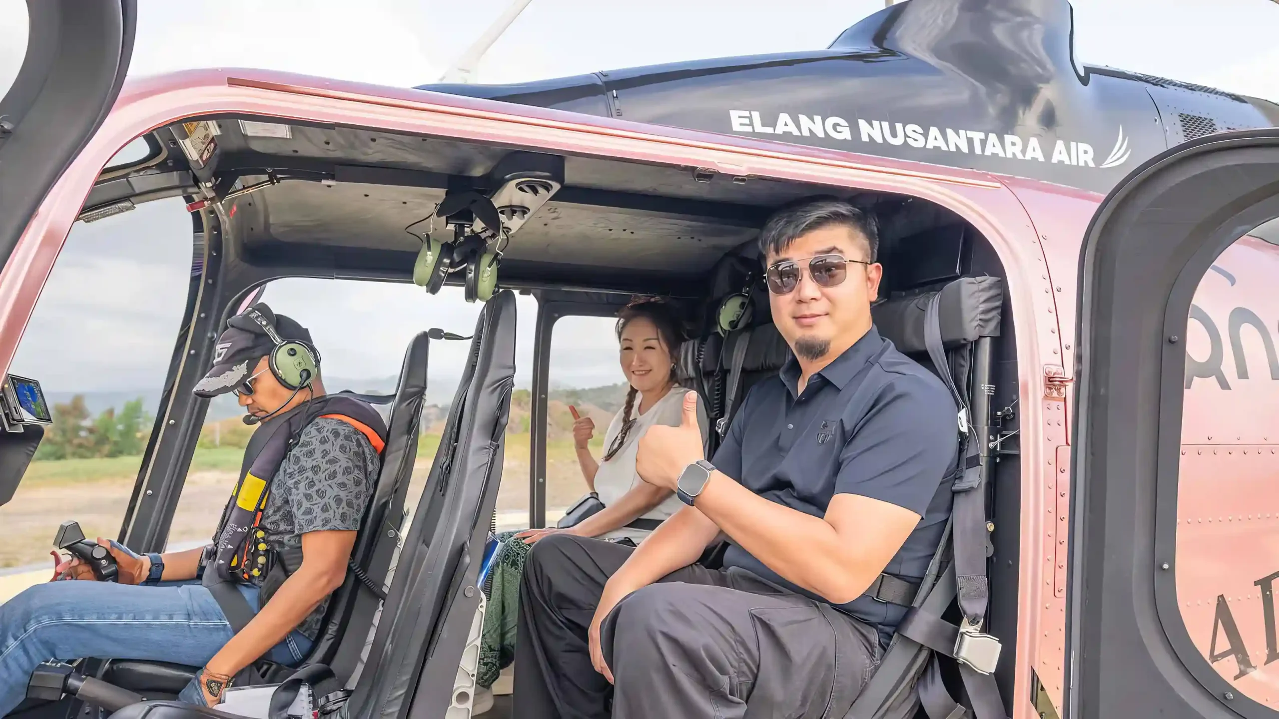 Passengers in a helicopter cabin on the Labuan Bajo route