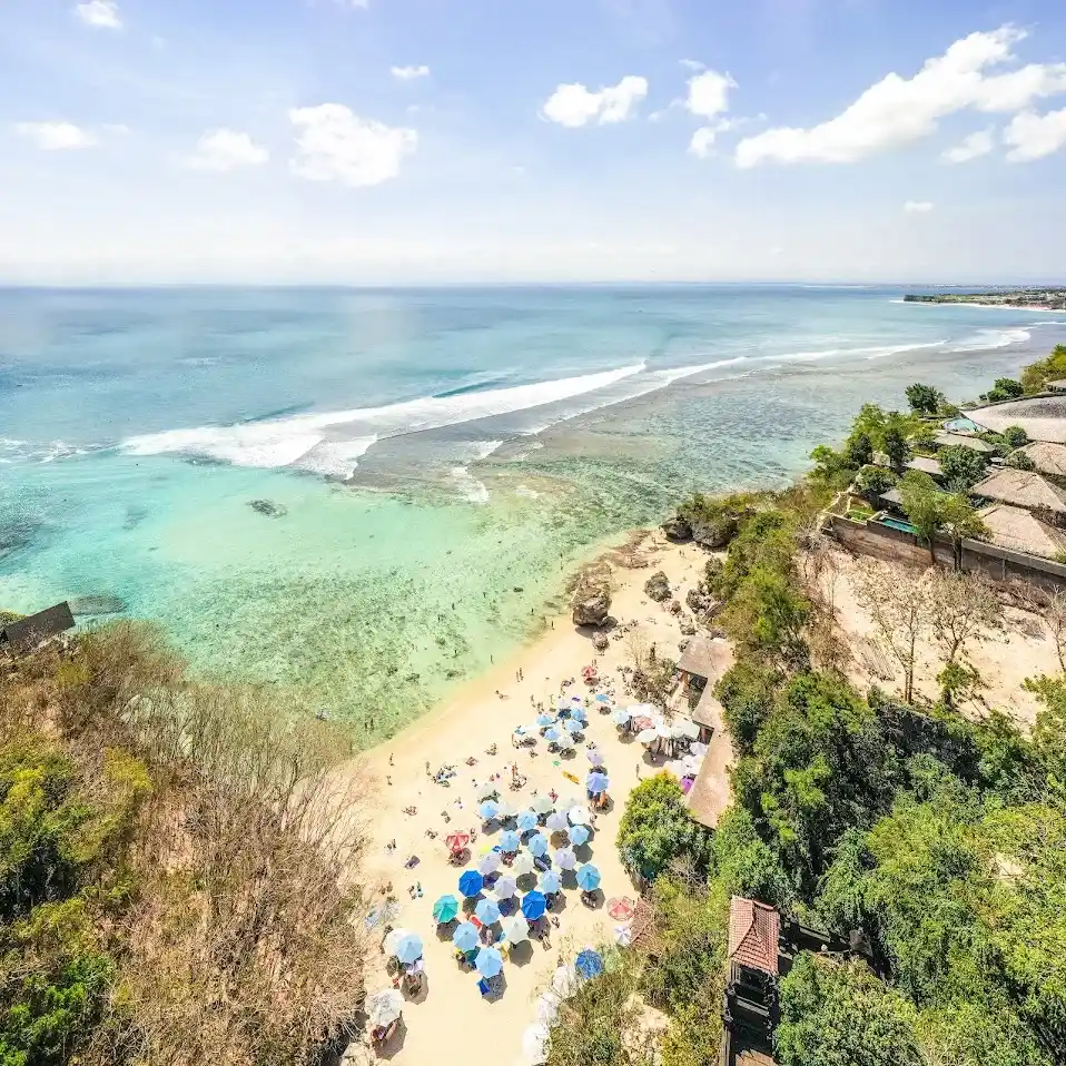 The reef and sheltered sand of Padang Padang beach seen from the cliff above