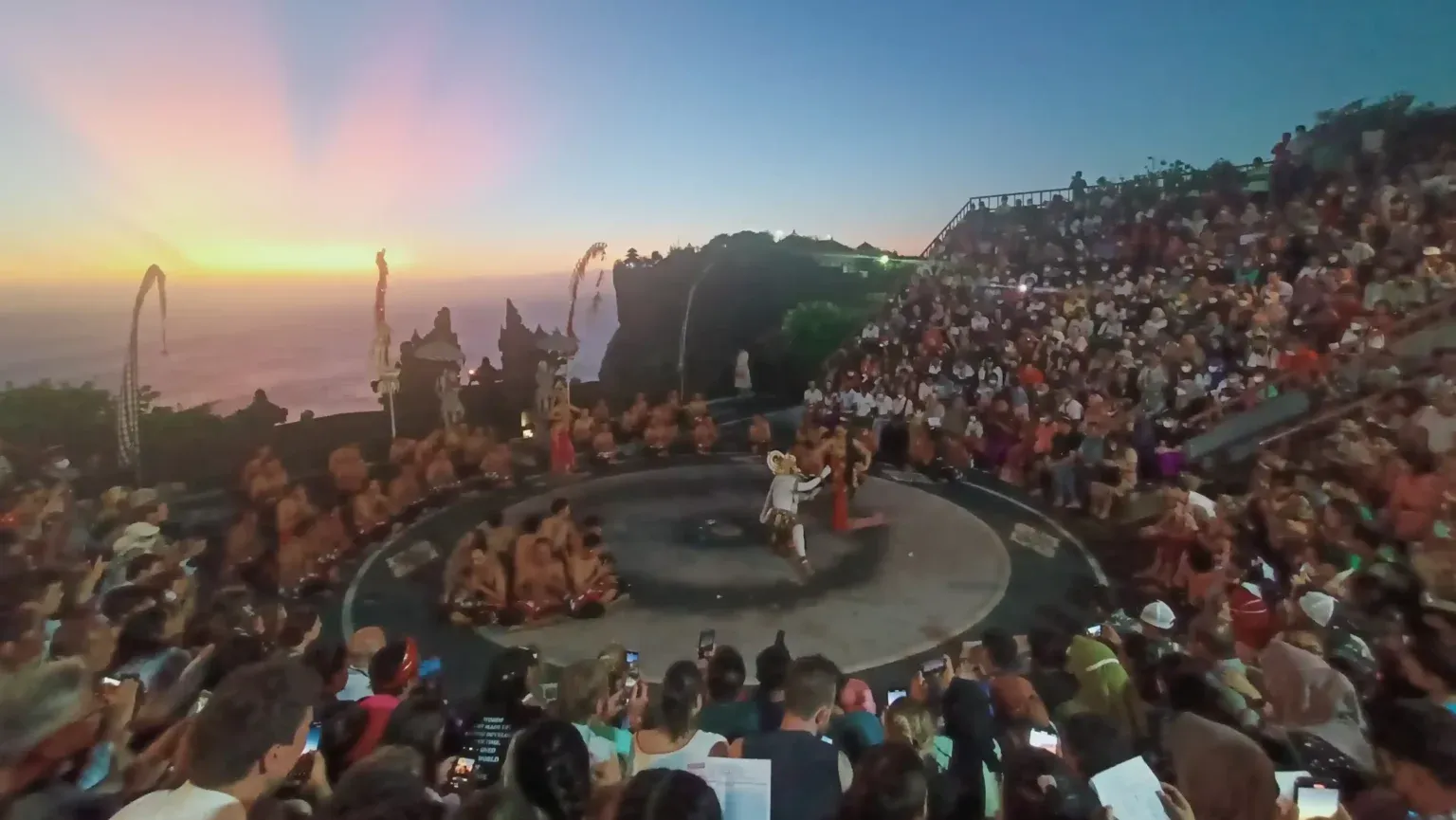 A full amphitheatre watching the Kecak dance at Uluwatu at dusk