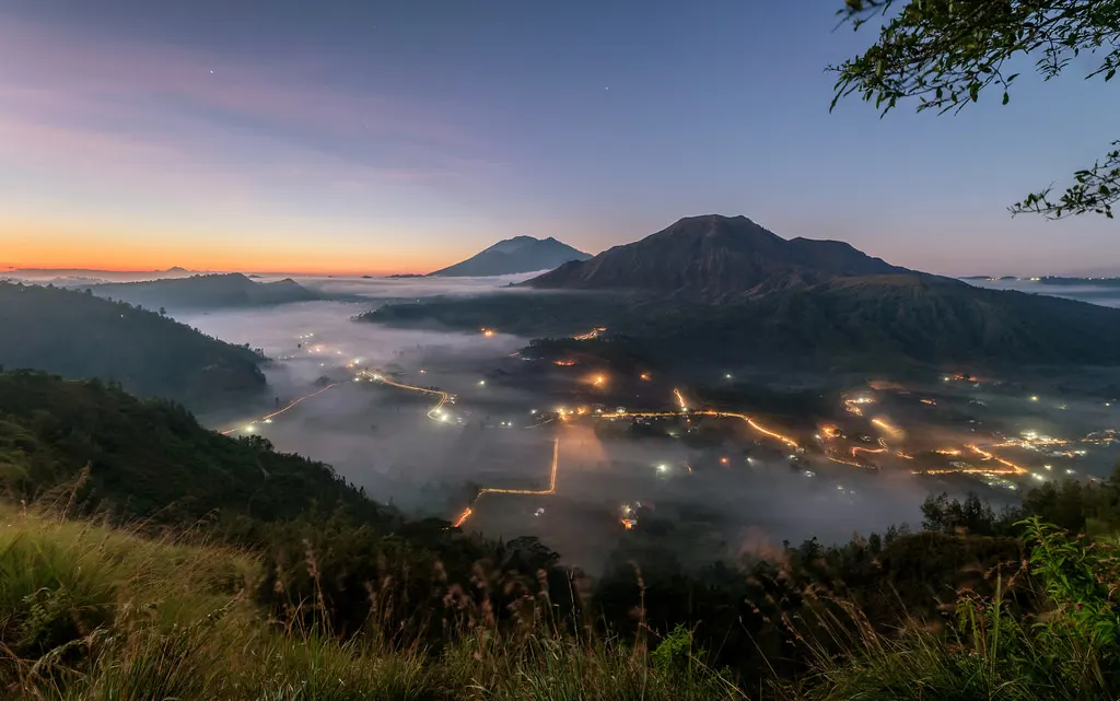 Dawn mist below Mount Batur seen from Pinggan village in Kintamani